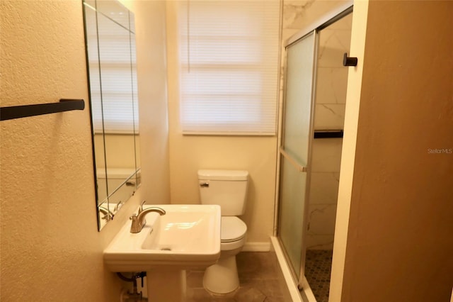 2704 NW 1st Ave, Gainesville, FL 32607 - full bathroom with a textured wall, a stall shower, and tile patterned floors
