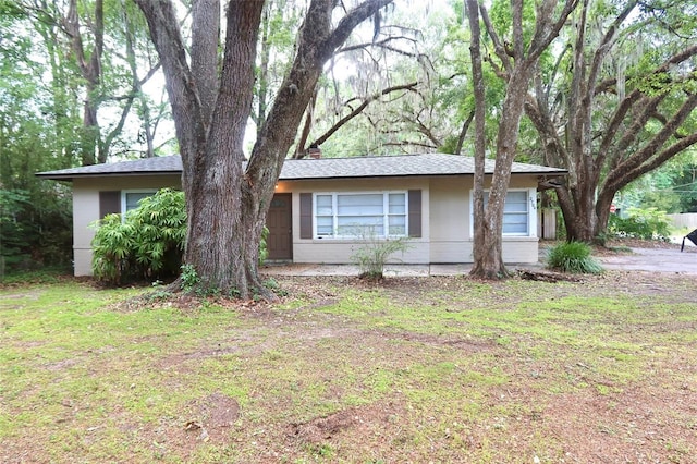 2704 NW 1st Ave, Gainesville, FL 32607 - single story home featuring a front lawn and a chimney