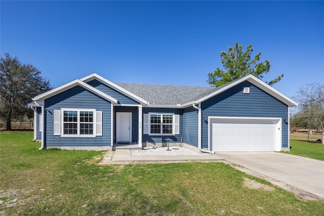 single story home featuring a garage and a front lawn