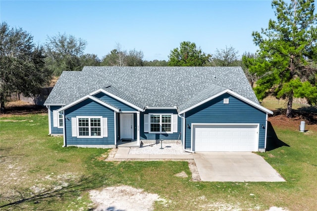 ranch-style home featuring a garage and a front lawn