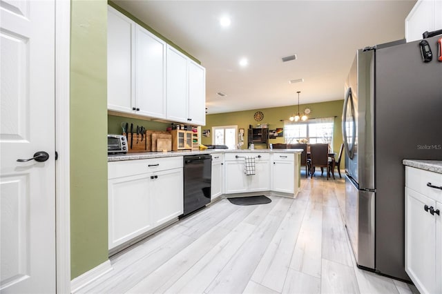 kitchen featuring white cabinetry, decorative light fixtures, stainless steel refrigerator, and dishwasher