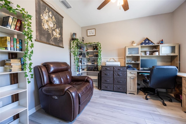 office space with ceiling fan, lofted ceiling, and light hardwood / wood-style floors