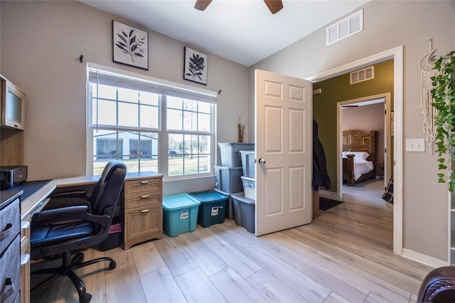 home office with ceiling fan and light hardwood / wood-style flooring