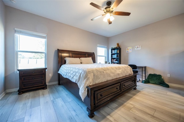 bedroom featuring light hardwood / wood-style floors and ceiling fan