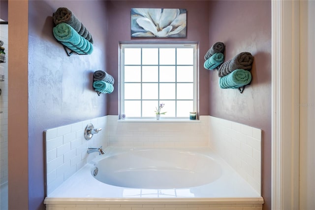 bathroom with tiled tub