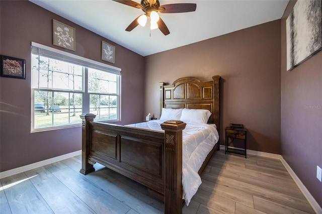 bedroom featuring ceiling fan and light hardwood / wood-style floors