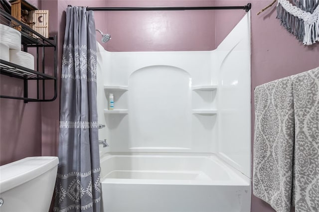 bathroom with toilet and shower / bath combo with shower curtain