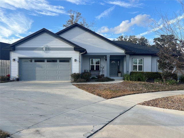 ranch-style house featuring driveway and an attached garage