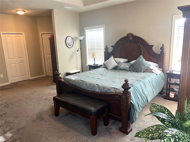 bedroom featuring carpet floors and baseboards