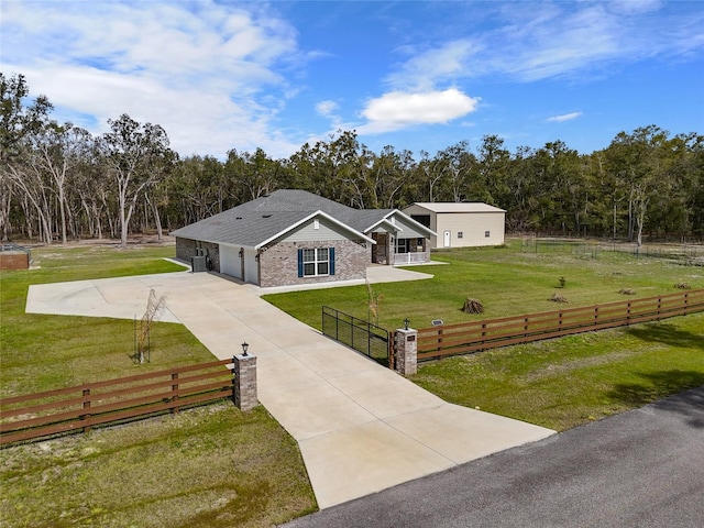 view of front facade with a garage and a front lawn