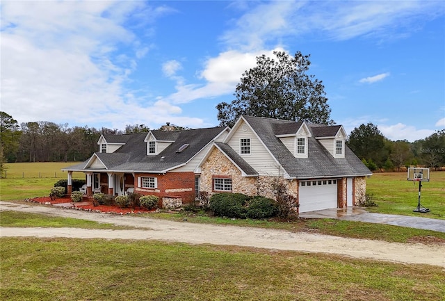 22617 NW 202nd St, High Springs, FL 32643 - new england style home with driveway, stone siding, a porch, and a front lawn
