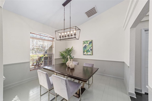 dining room featuring baseboards and visible vents