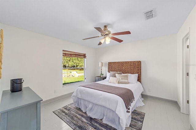 bedroom featuring baseboards, visible vents, and ceiling fan