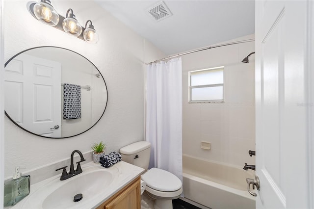 bathroom featuring visible vents, vanity, toilet, and shower / bath combo with shower curtain