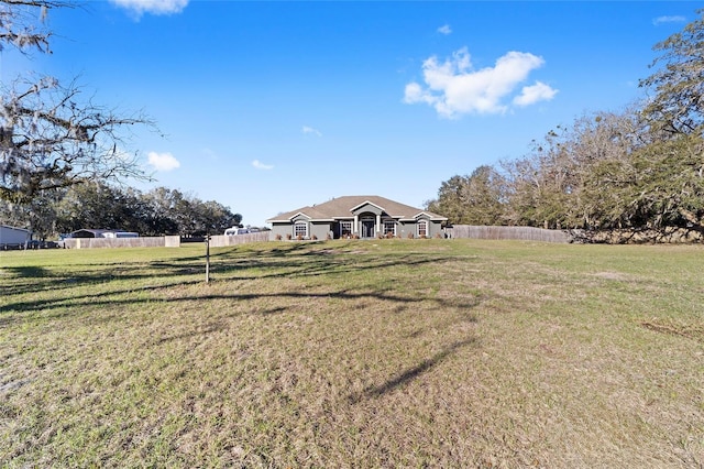 view of yard featuring fence