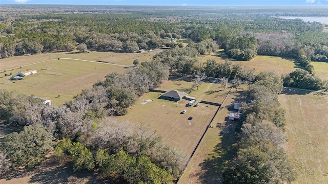 bird's eye view featuring a wooded view