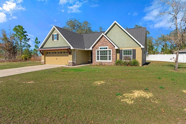 craftsman house featuring driveway, a shingled roof, stone siding, fence, and a front yard