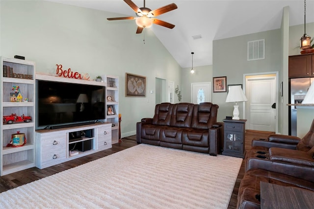 living area with high vaulted ceiling, ceiling fan, visible vents, and dark wood finished floors