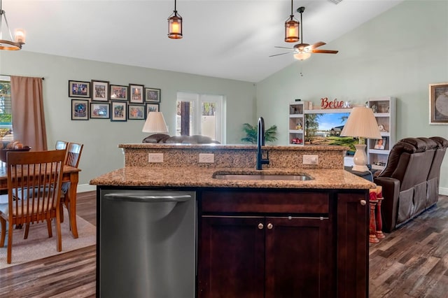 kitchen featuring dishwasher, open floor plan, decorative light fixtures, a healthy amount of sunlight, and a sink