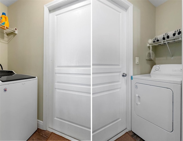 washroom featuring laundry area and washing machine and dryer