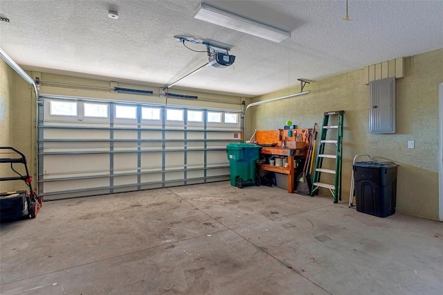 garage with a textured wall, electric panel, and a garage door opener