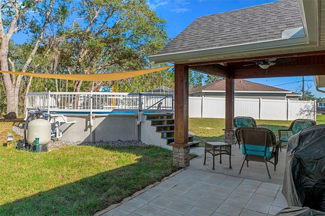 view of patio featuring a ceiling fan, a fenced in pool, stairway, fence, and a wooden deck