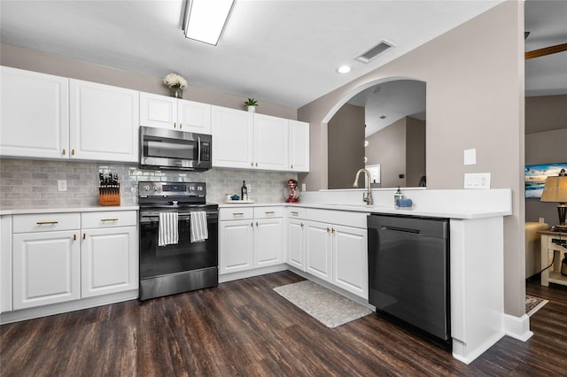 kitchen featuring dark wood finished floors, visible vents, appliances with stainless steel finishes, and light countertops