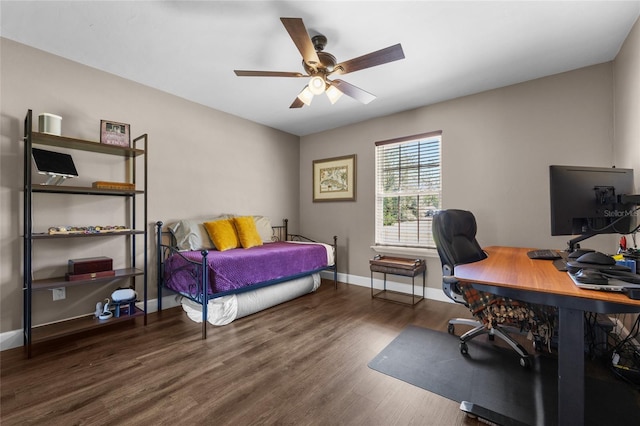 bedroom featuring a ceiling fan, wood finished floors, and baseboards