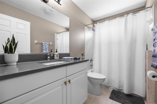 full bath with tile patterned flooring, shower / tub combo, toilet, and vanity