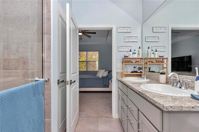 bathroom with tile patterned flooring, vanity, and ceiling fan