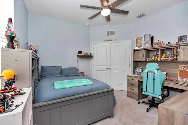 bedroom featuring ceiling fan and light carpet