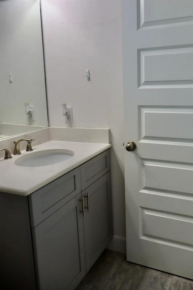 bathroom featuring vanity and hardwood / wood-style floors