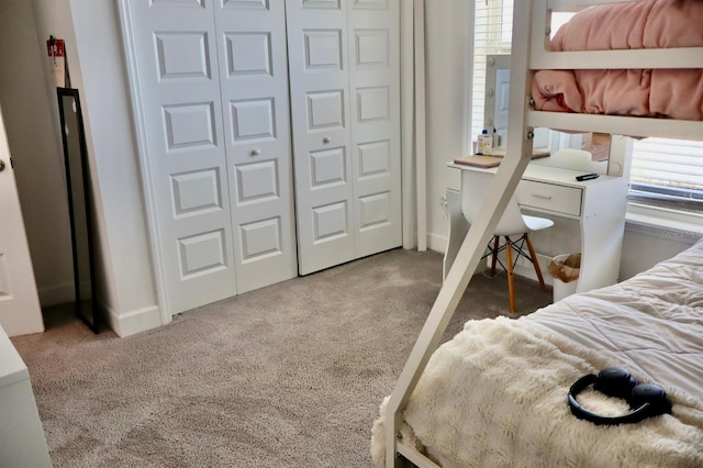 bedroom with carpet and a closet