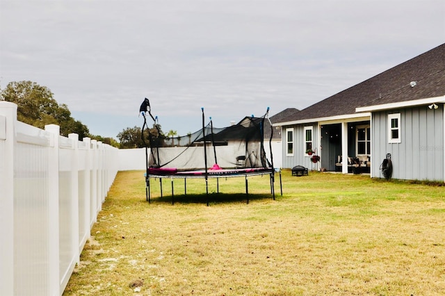 view of yard featuring a trampoline