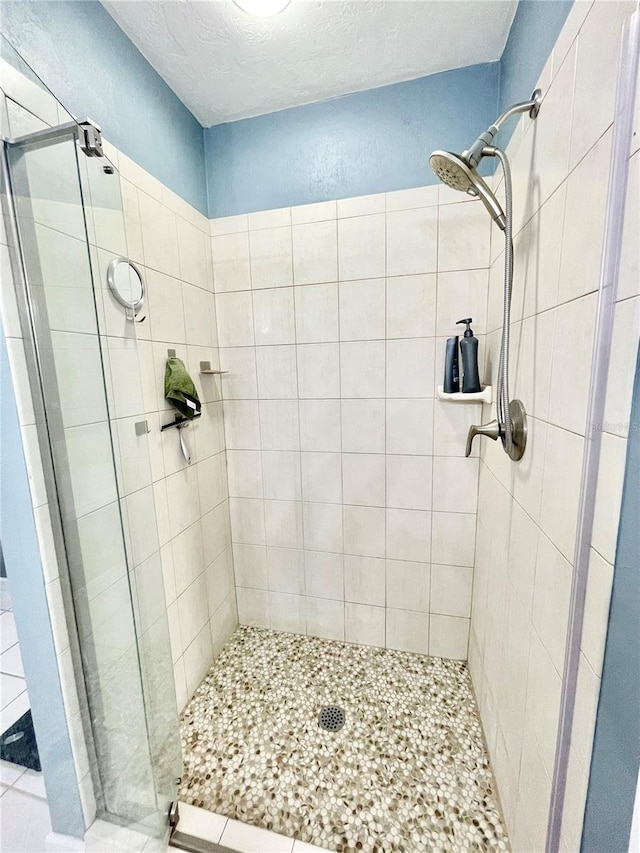 bathroom with a shower with shower door