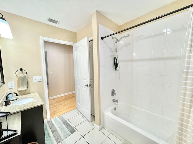 bathroom with vanity, tile patterned floors, and shower / bathtub combination with curtain