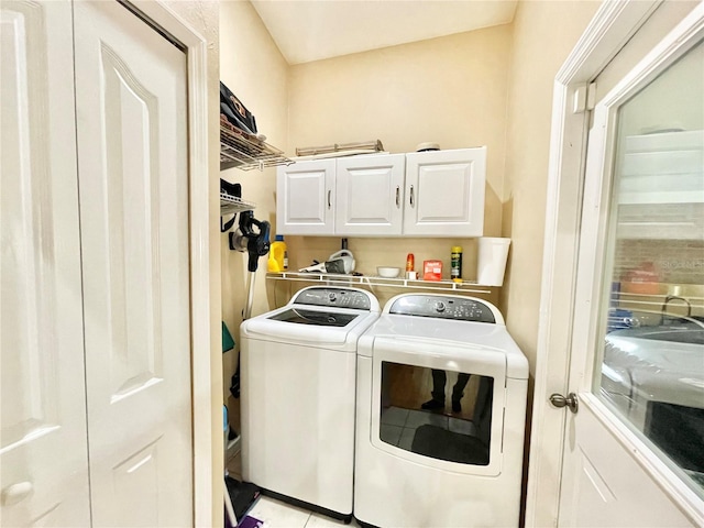 laundry area with cabinets and washer and dryer