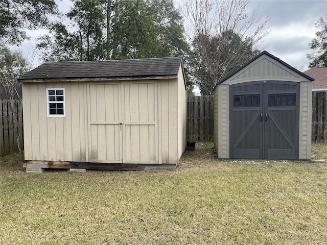 view of outbuilding with a yard