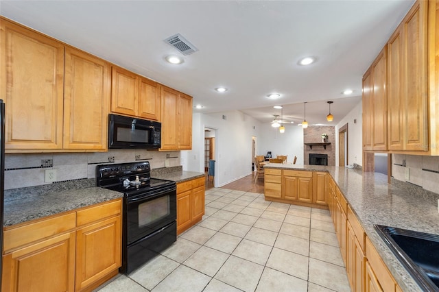 kitchen featuring a fireplace, visible vents, backsplash, a ceiling fan, and black appliances