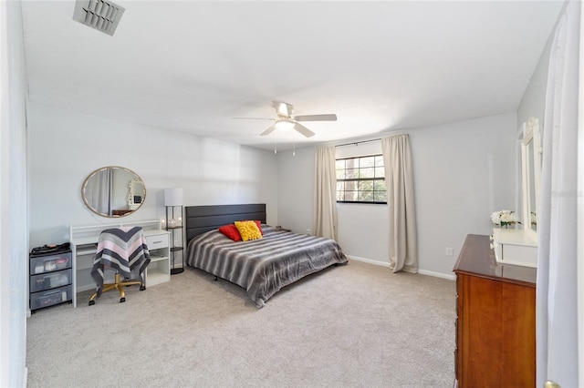 bedroom with carpet floors, visible vents, ceiling fan, and baseboards