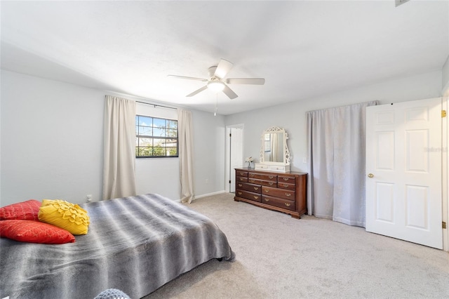 bedroom featuring ceiling fan, baseboards, and carpet flooring