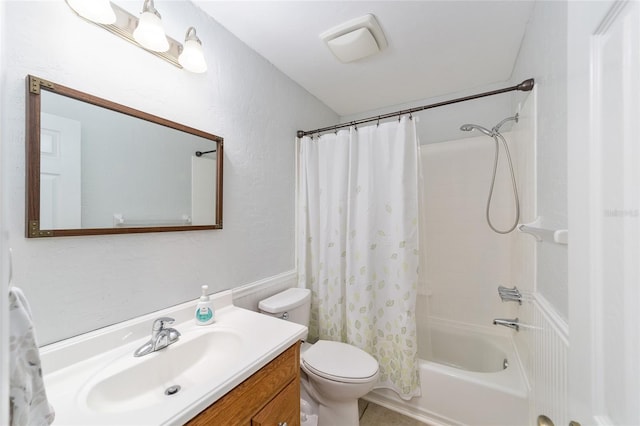 full bathroom with toilet, shower / bath combination with curtain, and vanity