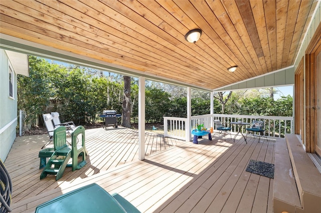 wooden terrace with area for grilling