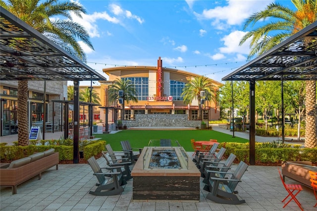 view of patio / terrace featuring an outdoor fire pit and a pergola