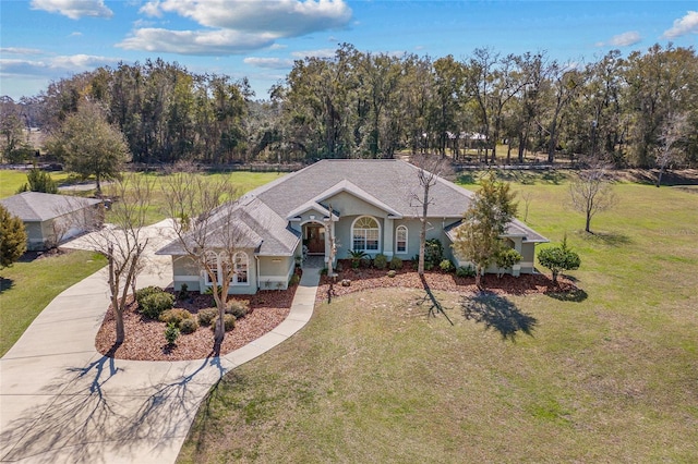 ranch-style house with a front yard and driveway