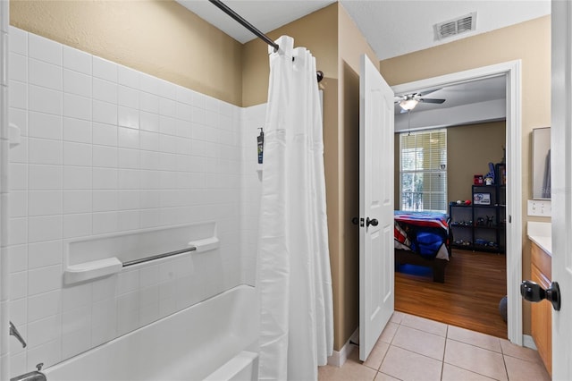 bathroom featuring visible vents, shower / bath combo, ceiling fan, connected bathroom, and tile patterned floors