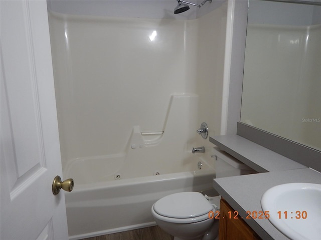 full bathroom with shower / washtub combination, vanity, toilet, and wood finished floors