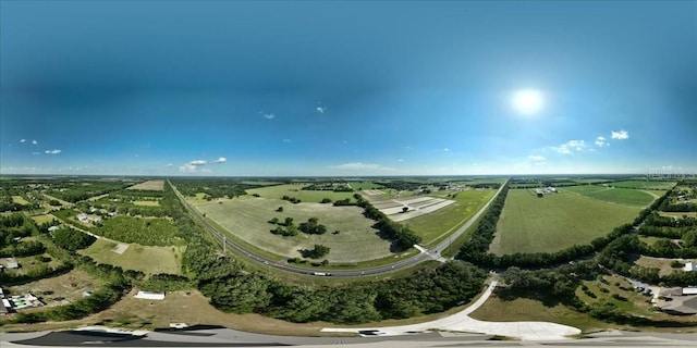 birds eye view of property with a rural view