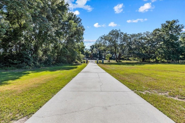 view of home's community featuring a lawn