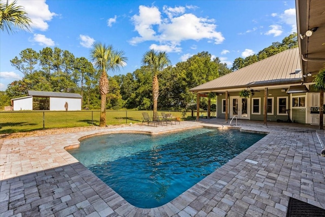 view of swimming pool with a fenced in pool, a patio area, fence, and ceiling fan